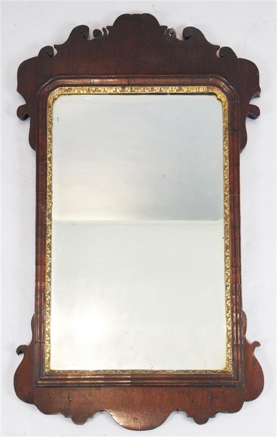 A George II walnut and parcel gilt fret framed wall mirror, W.2ft H.3ft 3in.